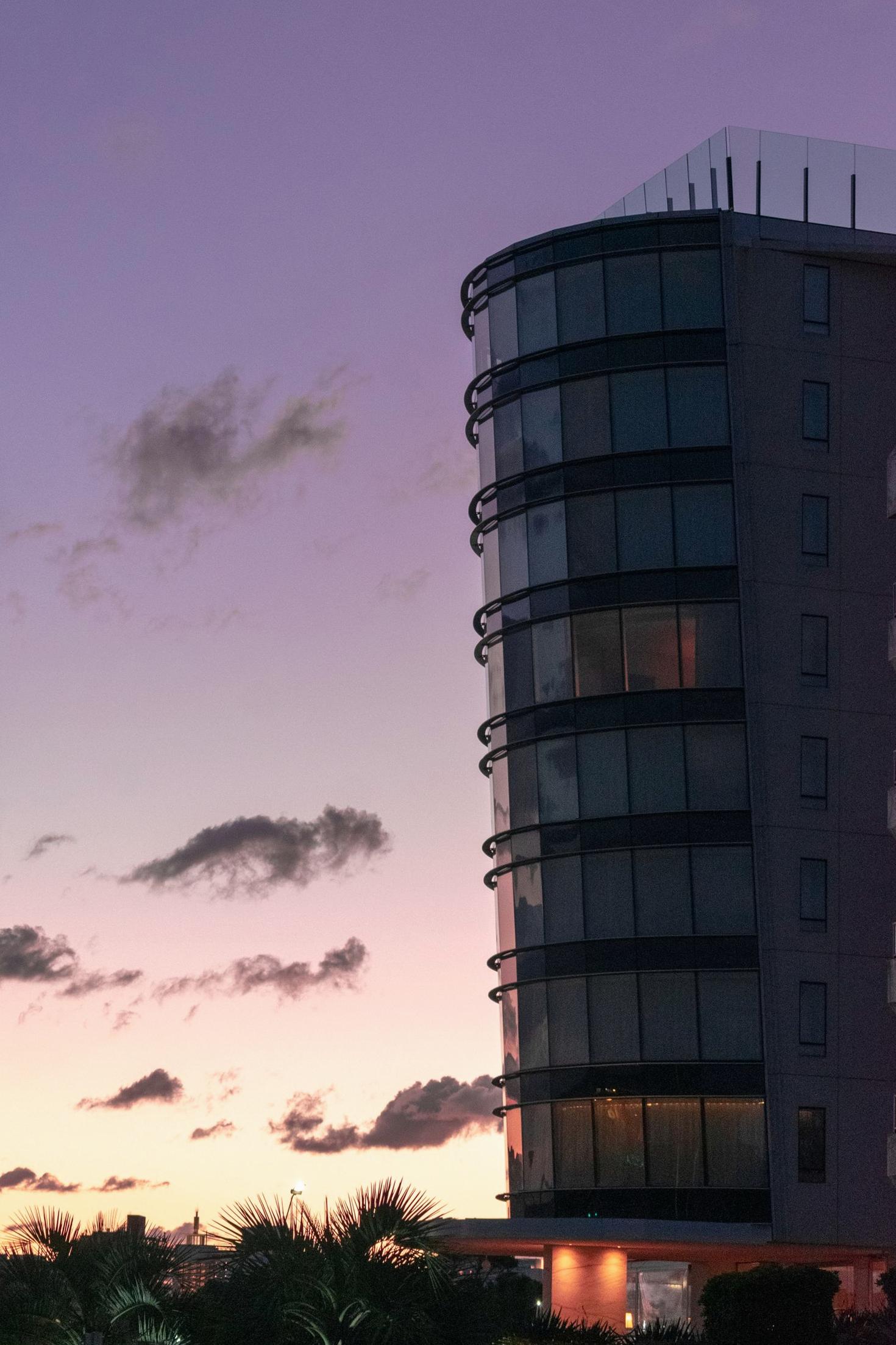 Joyquora Hotel exterior at dusk